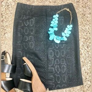 Express black knee length snake print pencil skirt